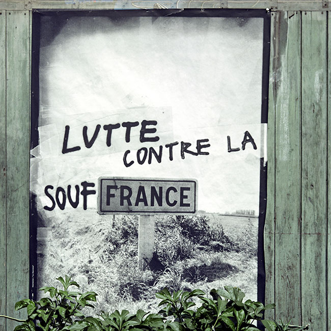 Lutte contre la souffrance - un graph'mur ou street art sous forme d'affiche, photographié par © Norbert Pousseur