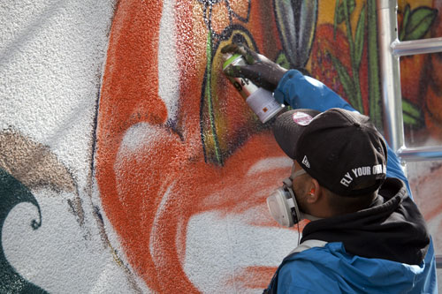 Graffiti artist with mask of paint, of DMJC - © Norbert Pousseur