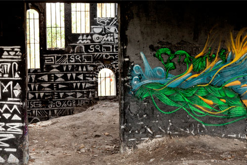 Mural paiting of color in middle of signs in black - © Norbert Pousseur