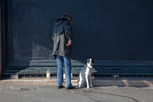 Homeless against a wall - © Norbert Pousseur